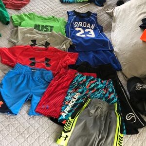 Boys Under Armour/  Nike lot of shirts and shorts.